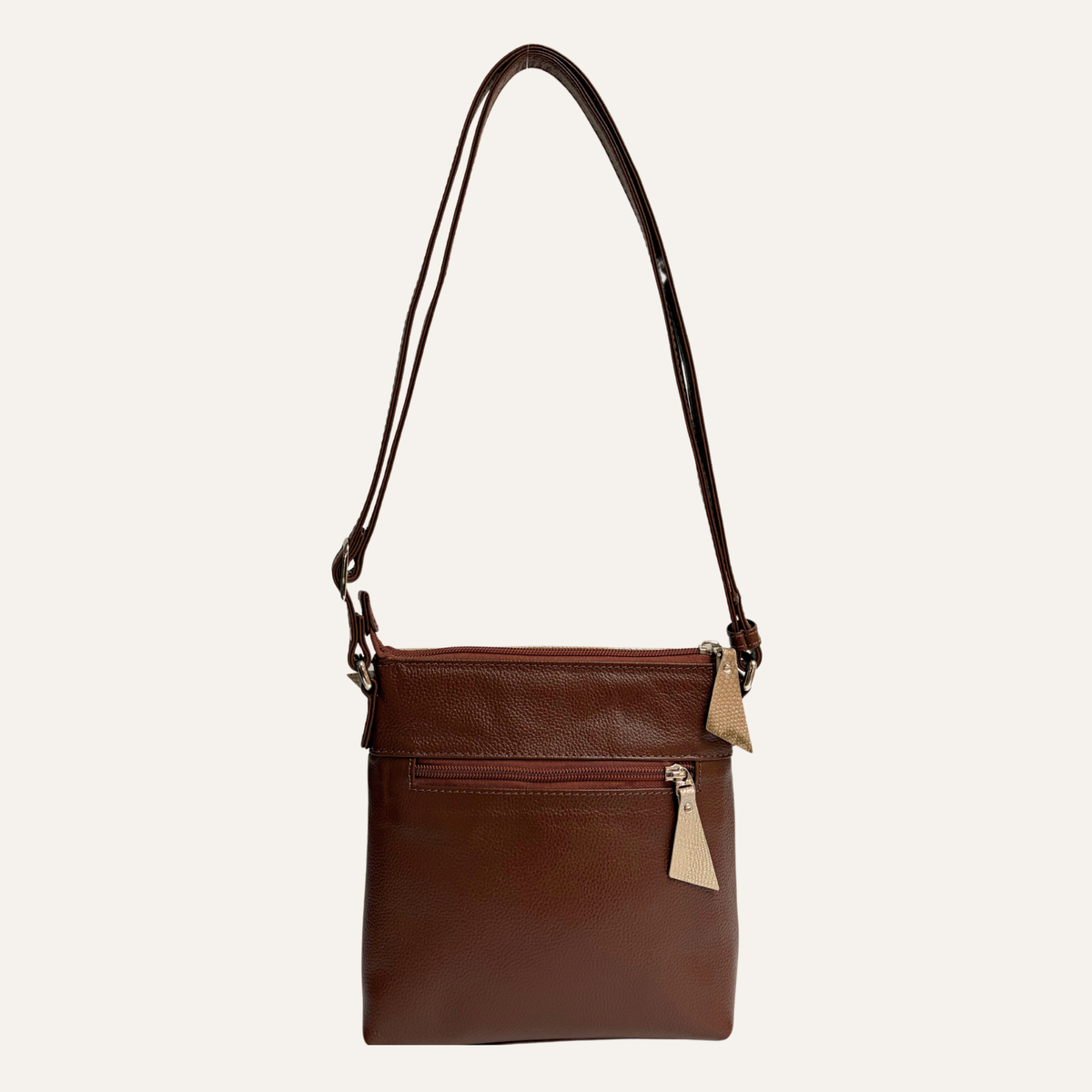 Manos libres con bolsillo frontal en cuero beige marmolado